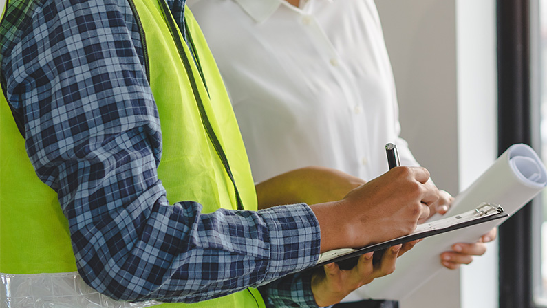 Builder inspection consultancy. Inspector checking material and structure in construction.