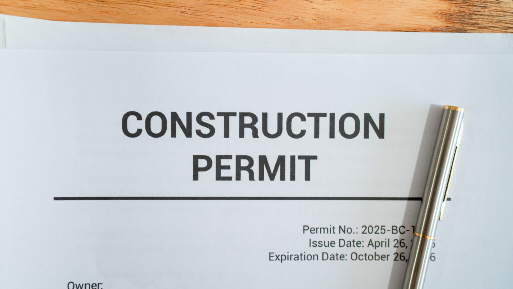 Close up of construction permit. Concept of permit for real estate development.